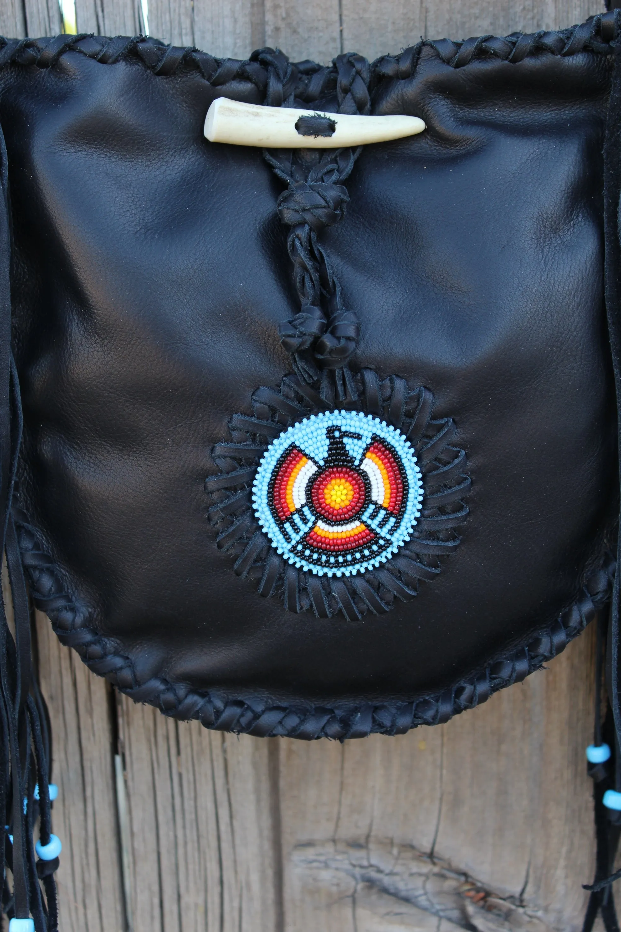 Black leather tote, beaded Thunderbird tote handbag